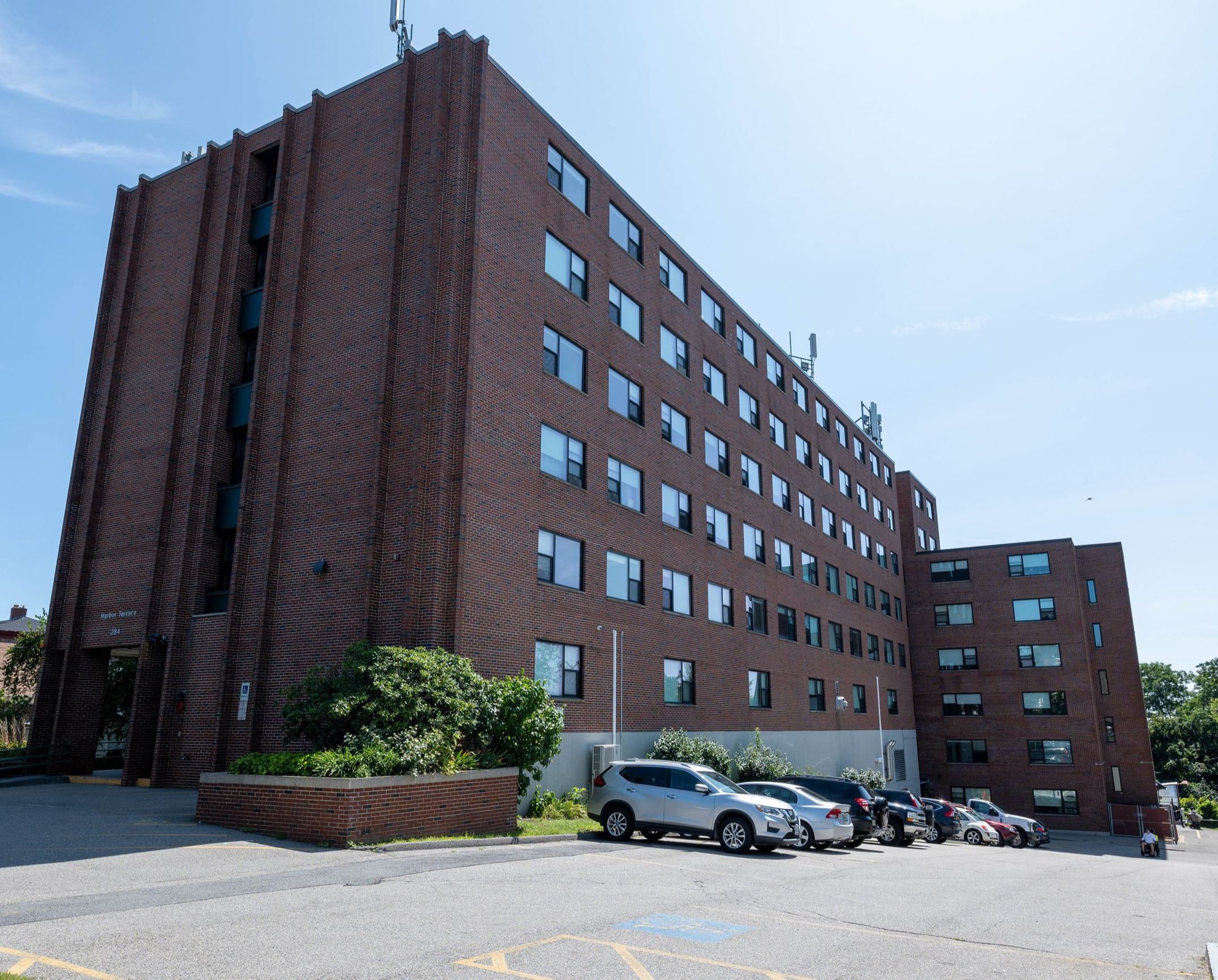 Image of Harbor Terrace, Six story brick apartment building from the front corner